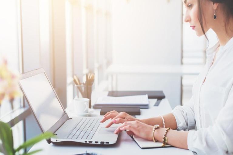 resized woman writing cv on laptop 1110x740